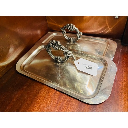 200 - A pair of antique silver plated serving lids