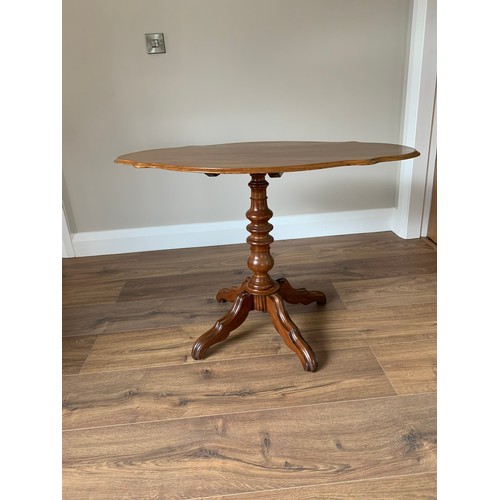 110b - Tilt top Victorian occasional table with a walnut top on a centre pod 27'' x 39''