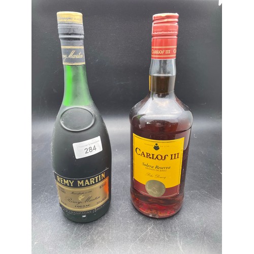 284 - Bottle of Remi Martin Cognac and Carlos 111 brandy