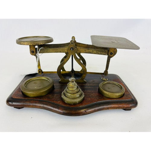 256 - Vintage post office scales on oak base + weights