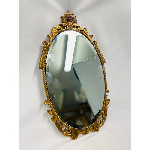 40 - Oval gilt framed mirror with beveled glass, 20''