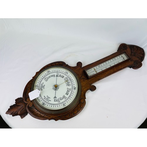 17 - Carved oak barometer