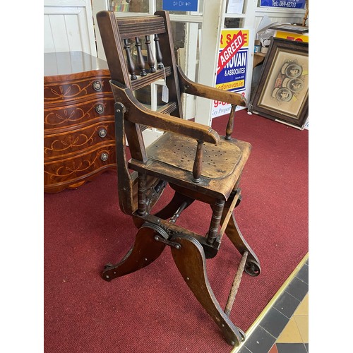 85 - Early Victorian Childs high chair on castors (folds 
 into a buggy), 37''h x 13'' w