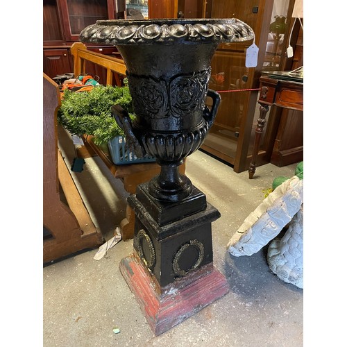 98 - A pair of heavy cast iron garden urns on pedestals, 41''h x 18''d