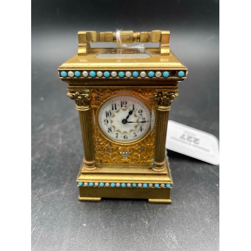 227 - Miniature Victorian windup carriage clock heavily decorated and with beveled glass , 3'5''h, heavy t... 