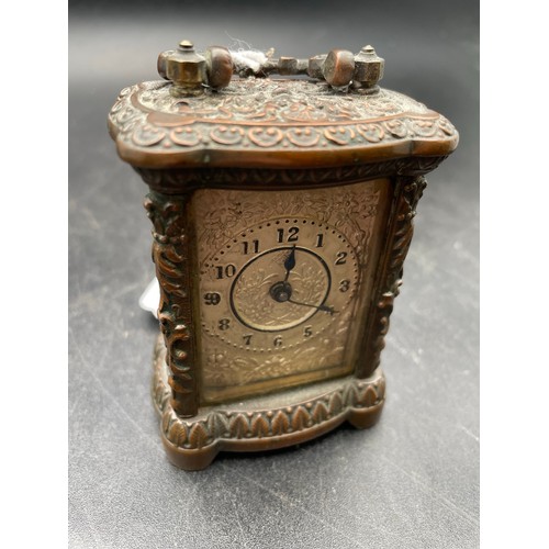 228 - Miniature Victorian windup carriage clock heavily decorated and with beveled glass , 3'5''h, heavy t... 