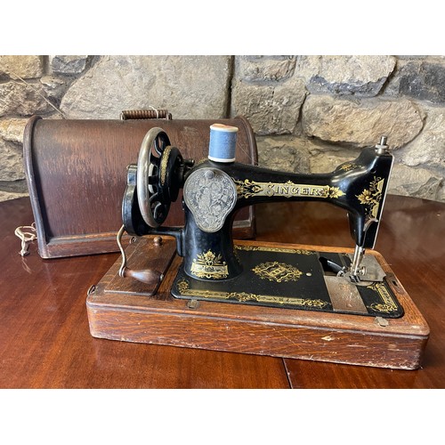 307 - Singer sewing machine in case with key