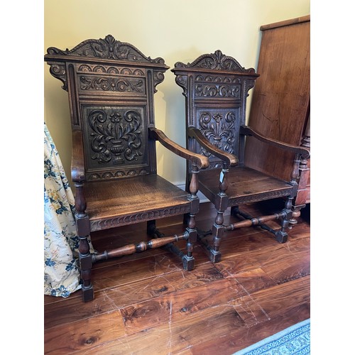 117 - A pair of carved oak wainscot armchairs, circa 1880, 16''seat, 46''overall