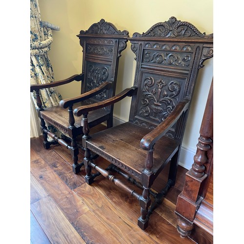 117 - A pair of carved oak wainscot armchairs, circa 1880, 16''seat, 46''overall