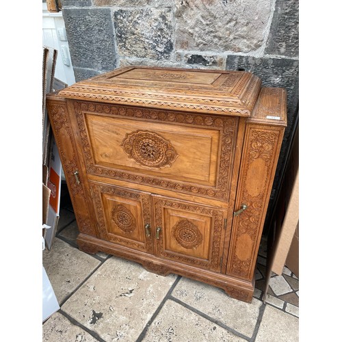 53 - Oriental heavily carved rosewood drinks cabinet, 36''w x 17''d x 36''h
