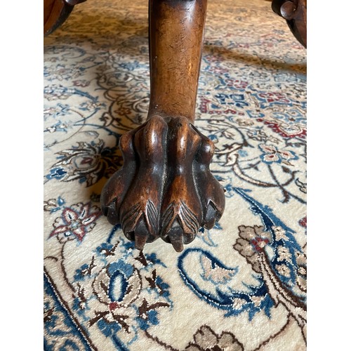 119 - A magnificent Georgian Irish tilt top, rosewood dining table on a centre pod with hairy claw feet wi... 