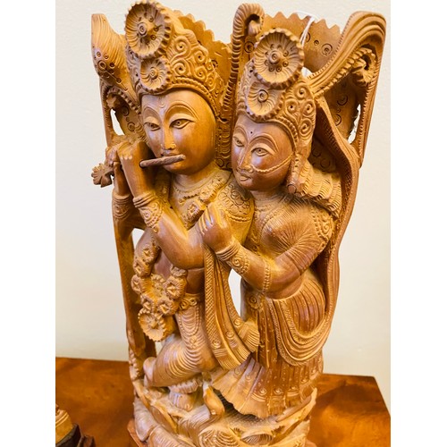 141 - A pair of Sandalwood carved Asian Deities, 14''h