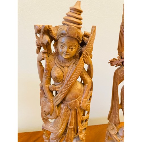 141 - A pair of Sandalwood carved Asian Deities, 14''h