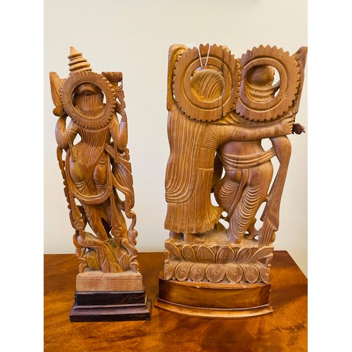 141 - A pair of Sandalwood carved Asian Deities, 14''h