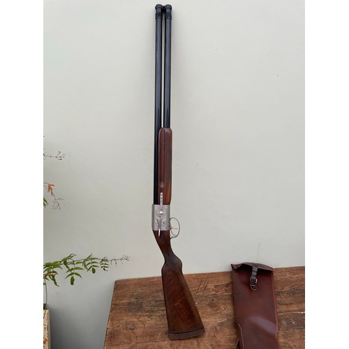 150A - Baby Bretton French sliding breech over and under shotgun with aluminium engraving. 12g. Leather hol... 