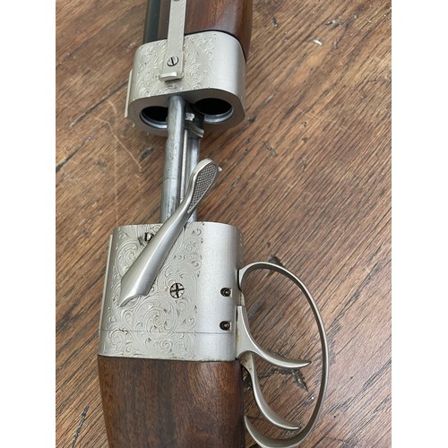 150A - Baby Bretton French sliding breech over and under shotgun with aluminium engraving. 12g. Leather hol... 