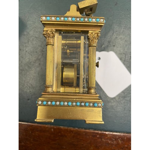 227 - Miniature Victorian windup carriage clock heavily decorated and with beveled glass , 3'5''h, heavy t... 