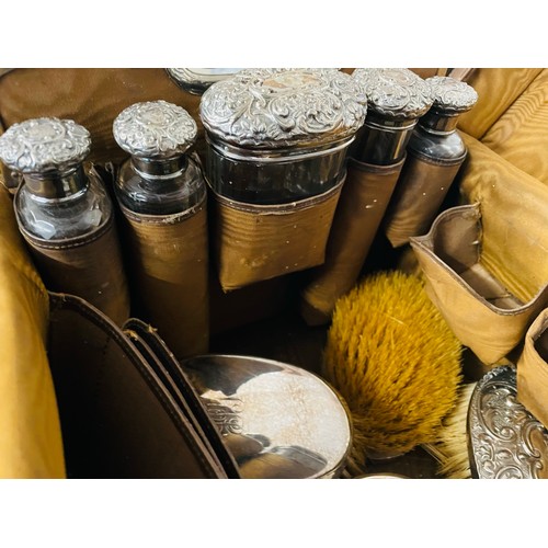 80 - Magnificent 1920's toiletry bag with crocodile leather and covers and brushes in sterling silver, 15... 