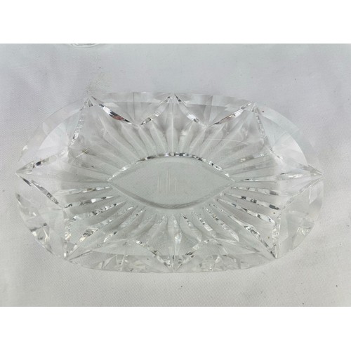 96 - A pair of Waterford Crystal alter cruets and a dish inscribed 'IHS'