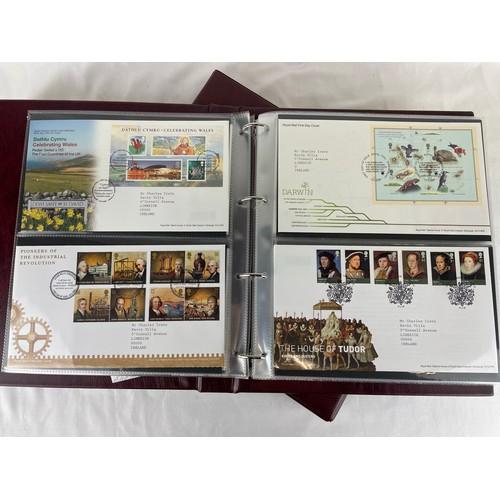 111 - A large collection of Royal Mail first day covers in a specially made deluxe folder