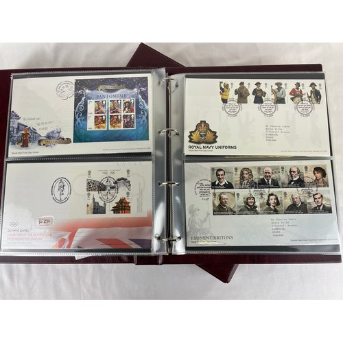 111 - A large collection of Royal Mail first day covers in a specially made deluxe folder