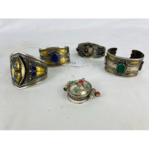 319 - A collection of oriental bracelets mounted with Lapis