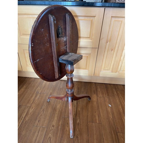 26 - Tilt top mahogany wine table on a single pod, 21''d x 23''h,