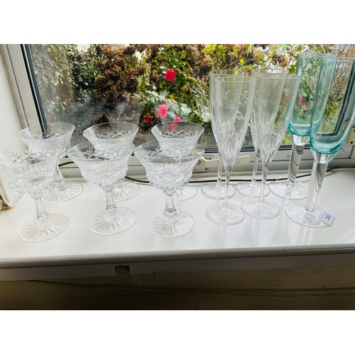 243 - A collection of 6 champagne flutes and  6 dessert bowls on stems