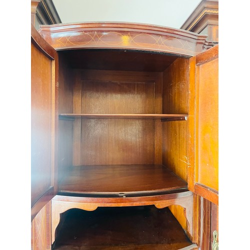 36 - A magnificent Victorian inlaid wardrobe of superb quality. The central section is bow fronted with a... 