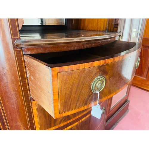 36 - A magnificent Victorian inlaid wardrobe of superb quality. The central section is bow fronted with a... 