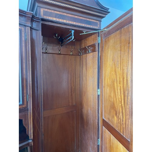 36 - A magnificent Victorian inlaid wardrobe of superb quality. The central section is bow fronted with a... 