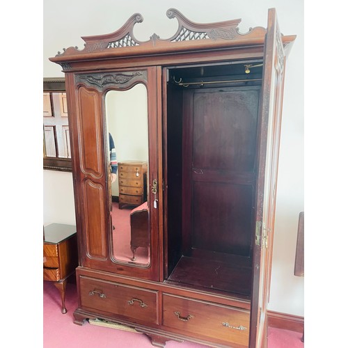 71 - Superb carved oak 2 door wardrobe over 2 drawers complete with original brass hooks and heavily carv... 