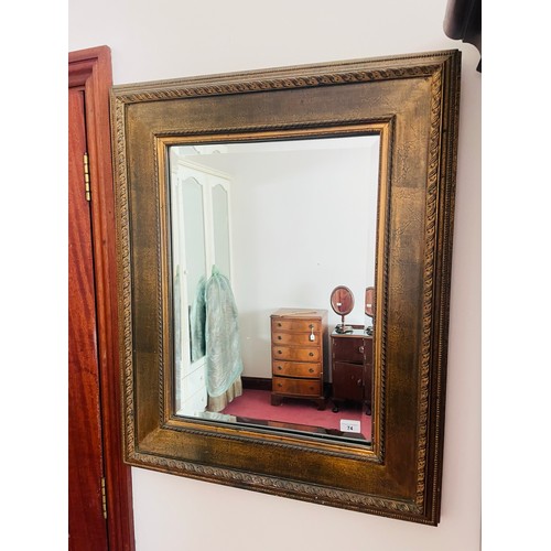 74 - Large gilt framed mirror with beveled glass, 33''h x 27''w