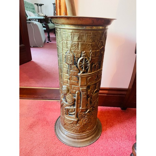 105 - Brass embossed umbrella stand, 20''h and one walking stick.