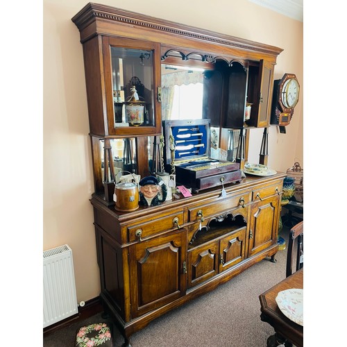 218 - Superb art Deco oak sideboard with tear drop brass handles and beveled glass mirrors, with three dra... 