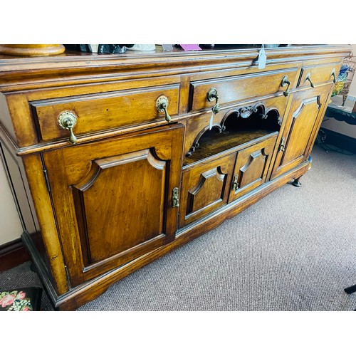 218 - Superb art Deco oak sideboard with tear drop brass handles and beveled glass mirrors, with three dra... 