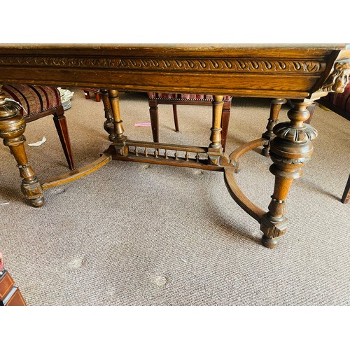 235 - Heavily carved early Victorian solid oak dining table with stretcher legs, profusely carved, 50''l x... 