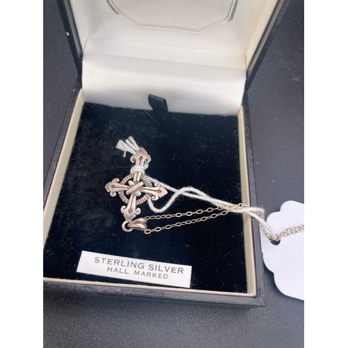 117 - Hallmarked silver crucifix and chain, 2 grams and box