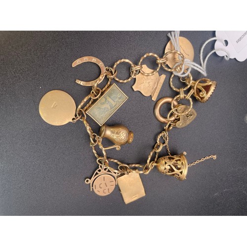 118 - Hallmarked 9 carat gold charm bracelet with complete with 9 hallmarked gold charms. 46 grams in weig... 