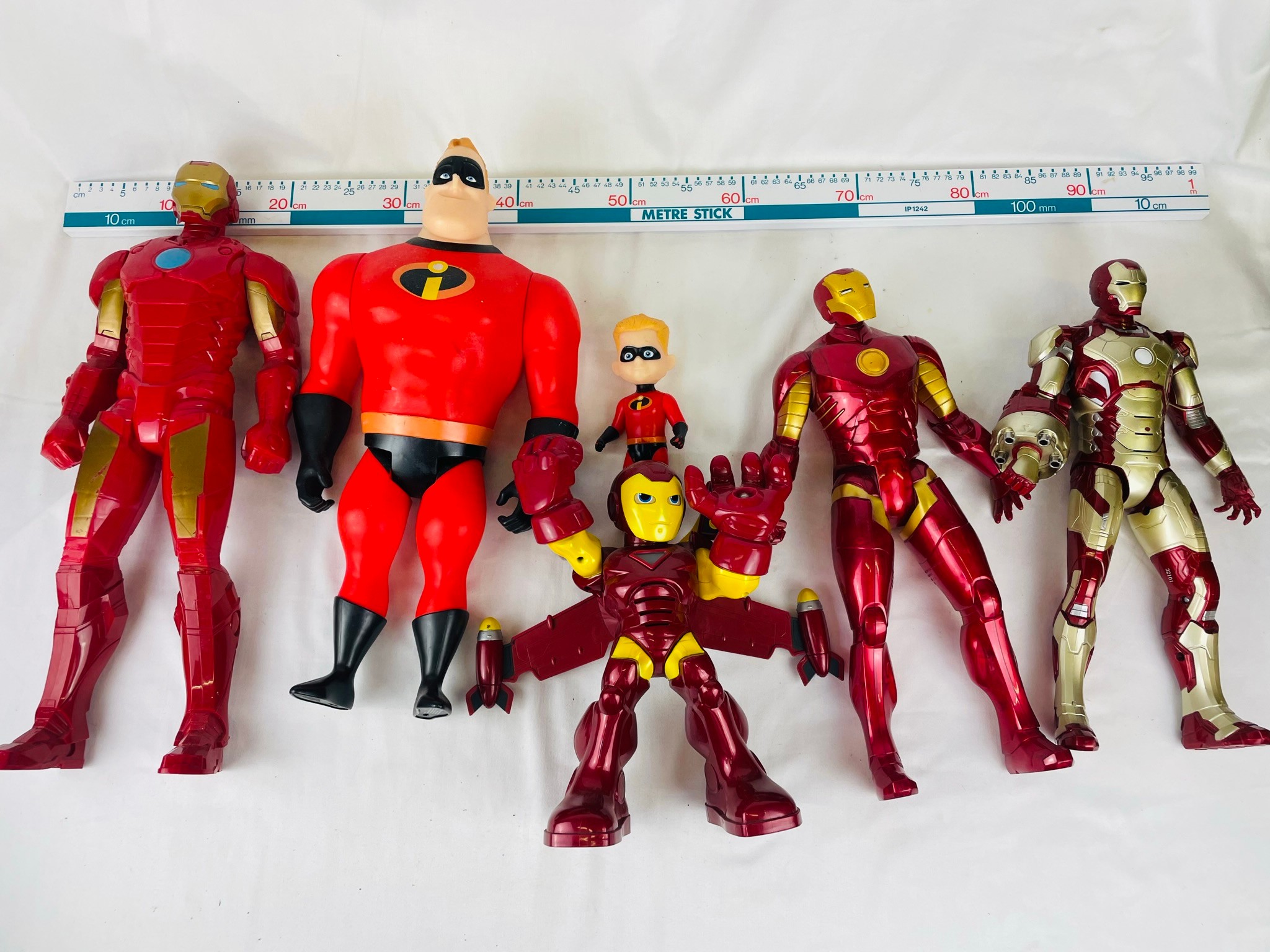 A collection of large action figures including Mr. Incredible