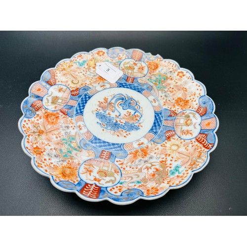 5 - Pair of Japanese Imari dishes. 12''d with lobbed body decorated in typical palate.