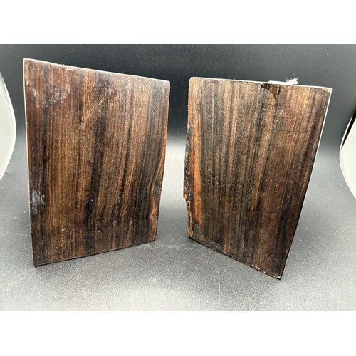 47 - A pair of African carved heavy bookends, 7.5''h