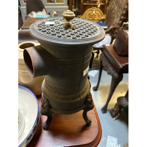 292 - A cast iron Victorian French stove on 3 legs with brass fitting, 50 cm h