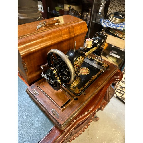 293 - Quality Jones' table top sewing machine in excellent condition complete with cover and key