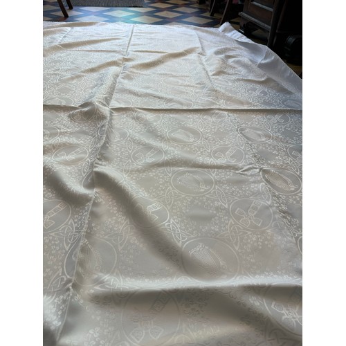 180 - Large Irish linen table cloth depicting Celtic Cross, Round Tower Harp etc. 68'' x 104''