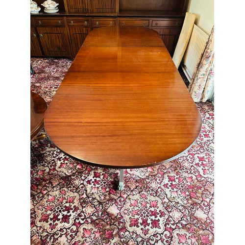 403 - Excellent quality extendable dining table with centre lead and D ends on 2 pods with brass castors t... 