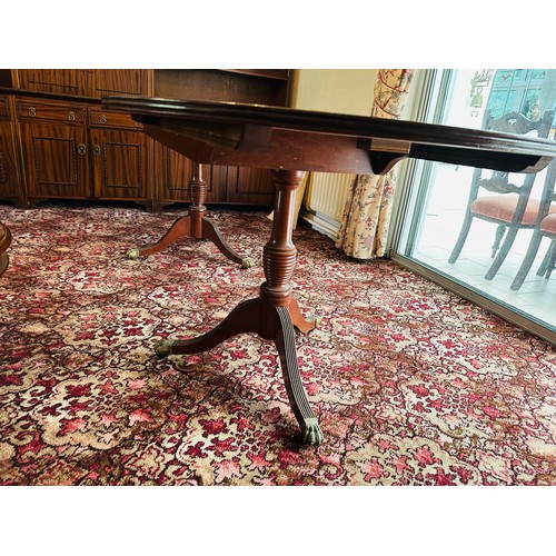 403 - Excellent quality extendable dining table with centre lead and D ends on 2 pods with brass castors t... 