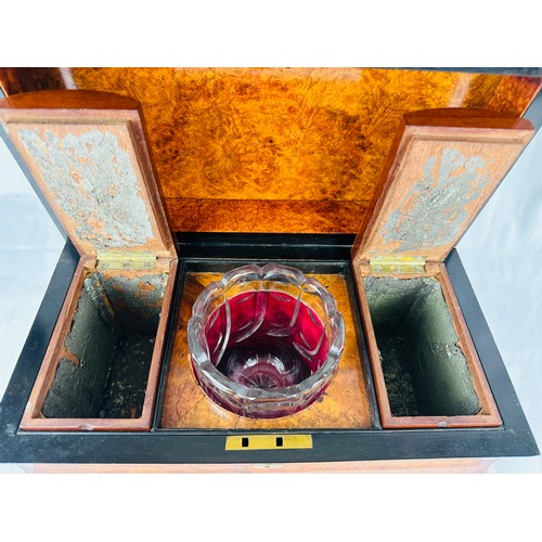 214 - Magnificent Georgian burr walnut tea caddy with a pyramid top and brass hinges. Inside are a pair of... 