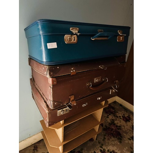 82 - A collection of 3 vintage suitcases