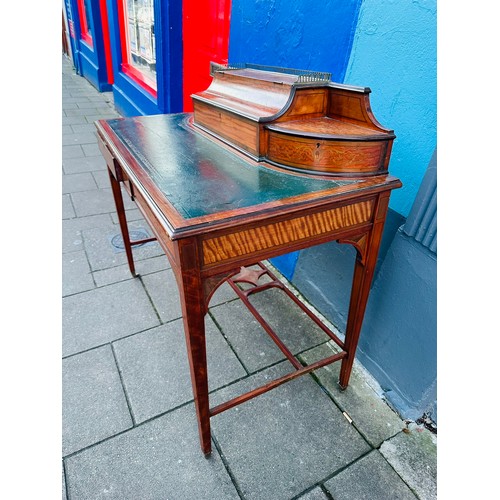 130C - Fine quality serpentine  Carlton House desk with an unusual hinged central lid that has several lett... 